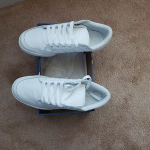 All white Adidas Hard Court Lows